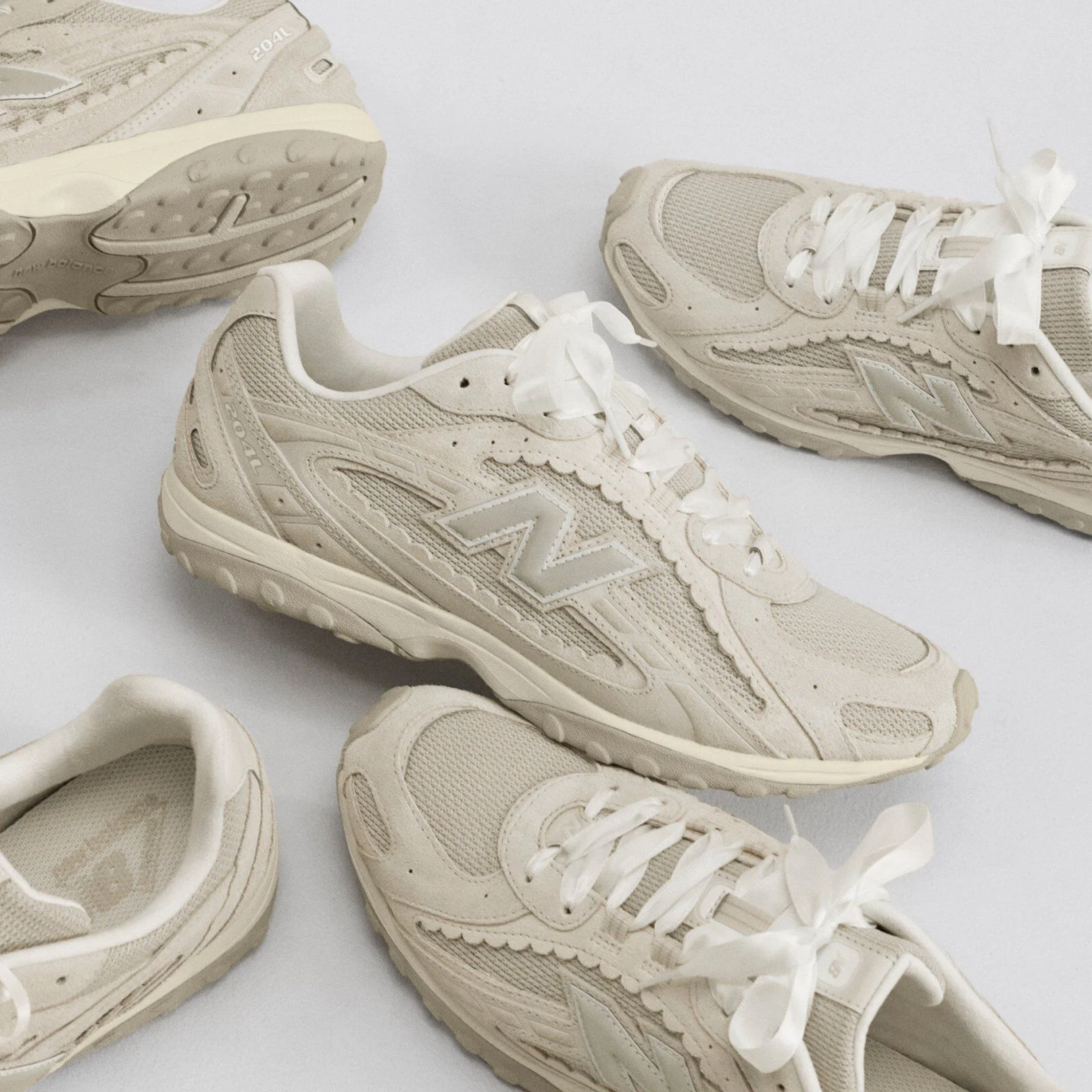  An enlarged shoe sitting in the middle of a forest with a mountain in the background.